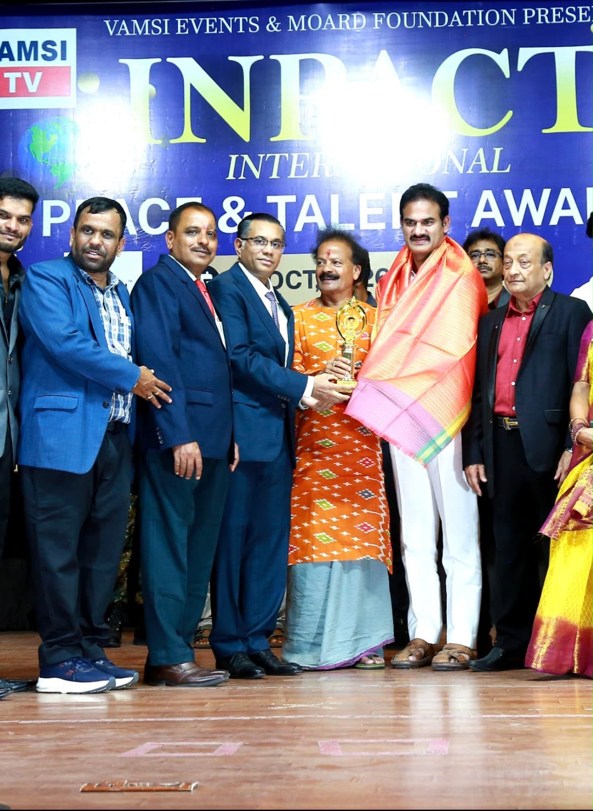 Dr. Mir Jawad Zar Khan with trophy at INPACT International Peace Awards 2026